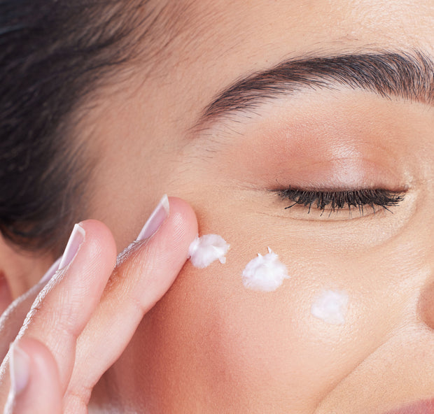 Model with Product on Cheek - Close Up