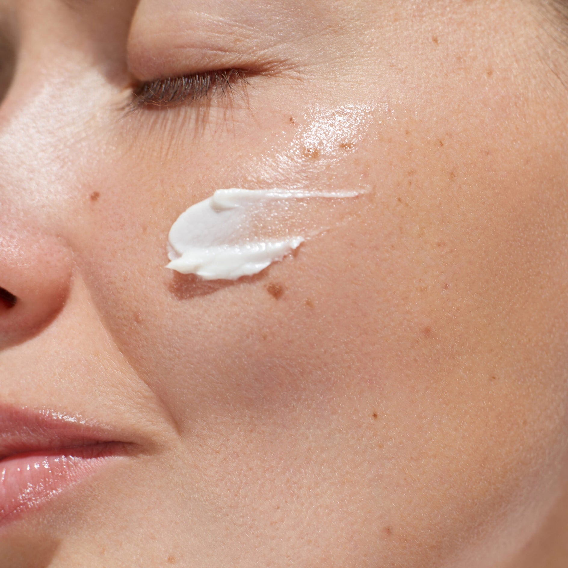 Model with Product on Cheek Close Up