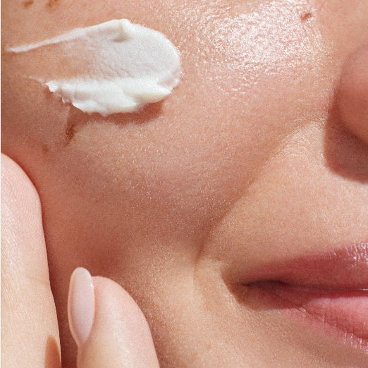 Model with Skincare on her cheek closer up